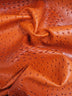 Poison Orange Mutant Ostrich Gator Embossed Vinyl Fabric / Sold By The Yard
